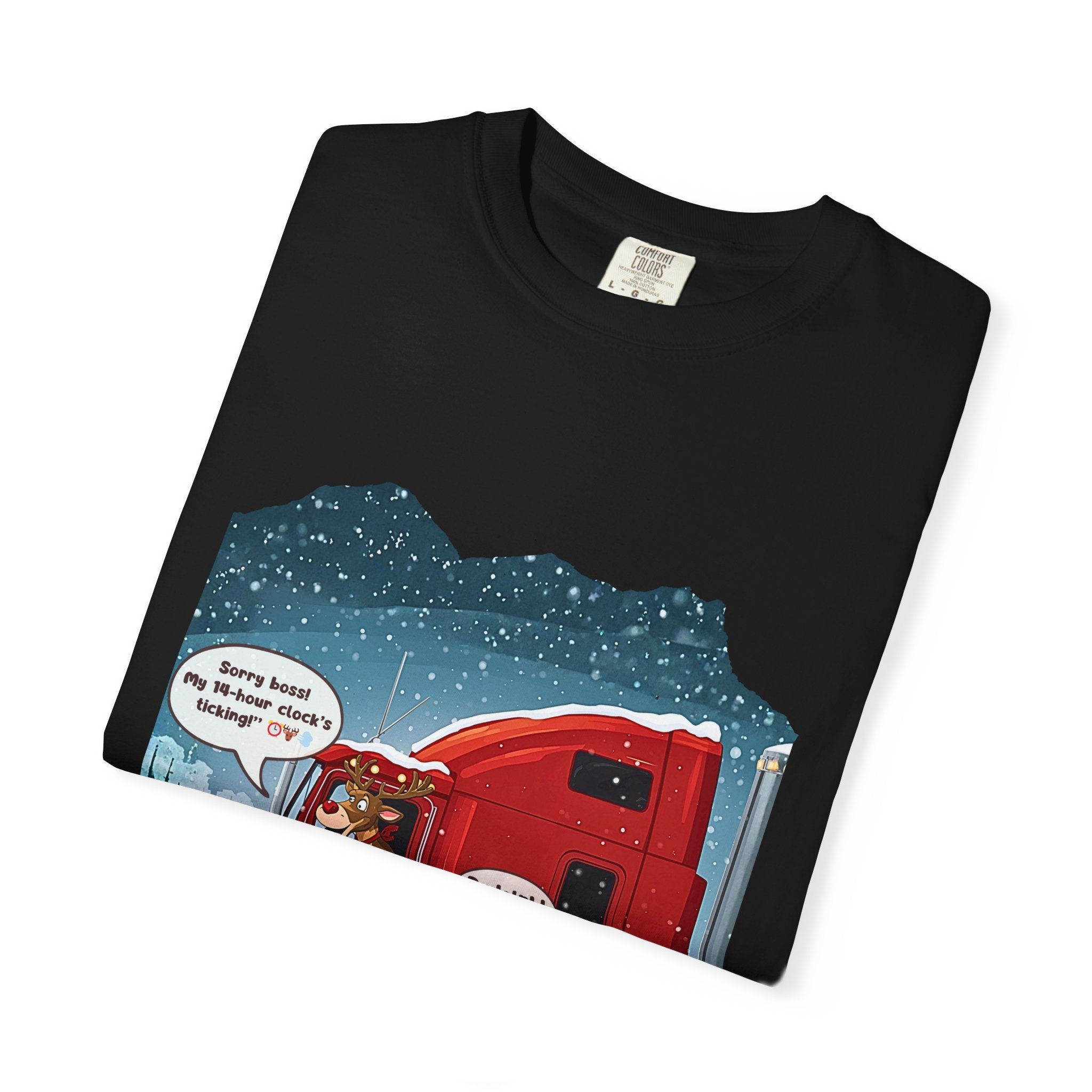 Trucking Christmas humor T-shirt featuring a red semi truck with a reindeer driver in snowfall.